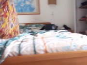 During my vacation at the beach, the owner of the hotel records me putting on suntan lotion