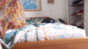 During my vacation at the beach, the owner of the hotel records me putting on suntan lotion