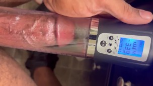 Big black dick getting pumped by penis pump. 