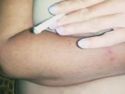 She smokes a cigarette and plays with her breasts 3/16