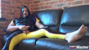 Rubber guy huffs and jerks uncut cock while showing feet PREVIEW