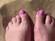 bare feet on a sandy beach 