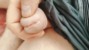 Guy caresses cock and balls and cums on the leg.