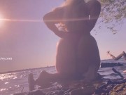 Bikini butt teasing in the water at a public beach!  13/16