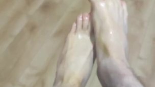 Rubbing my sexy feet with oil and showing my nails off