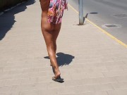 Hot girl walking undresses on a public street and shows off her pussy