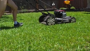 Readhead mowing lawn nude