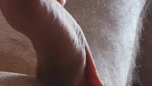 Moaning uncut dick with one finger