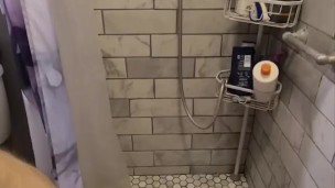 Caged slave drinks his own piss in the shower at Sir's request
