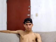 young man masturbates in the living room while the parents do not see him