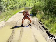 sexy blonde pissing in a puddle on the road 10/16