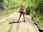 sexy blonde pissing in a puddle on the road 12/16