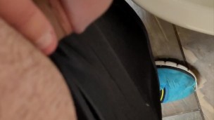 Chubby boy pissing in a public bathroom