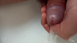 playing with peephole while I'm pissing 