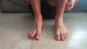 Horny guy massaging his feet. Foot fetish