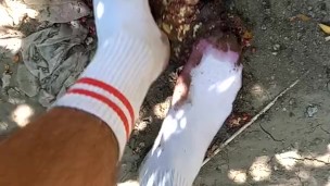 Outdoor food fruit crush with white socked feet