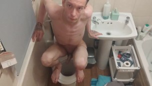 Skinny teen Having fun in bathroom pissing in toilet and putting his head inside of it