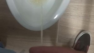 Peeing in a bathroom stall