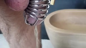 I love to show myself with the cage while I piss