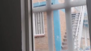 masturbating in the window facing the street