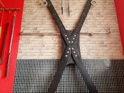 A slave on a St. Andrew's cross, and the dominatrix Nika milks his dick. Slave cums. 1/16