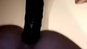 Slut fucked by black dildo doggy