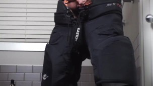 Straight hockey bro strokes his hard cock in his gear after the game