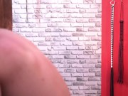 BDSM. Dominatrix whipped a slave who is in shackles. 13/16