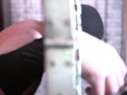 BDSM. Dominatrix whipped a slave who is in shackles. 15/16