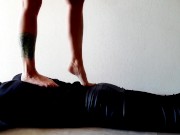 Trampling. Dominatrix Nika walks on the back of her slave with bare feet 10/16