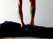 Trampling. Dominatrix Nika walks on the back of her slave with bare feet 11/16