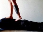 Trampling. Dominatrix Nika walks on the back of her slave with bare feet 3/16