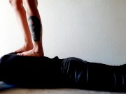 Trampling. Dominatrix Nika walks on the back of her slave with bare feet 4/16