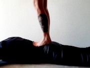 Trampling. Dominatrix Nika walks on the back of her slave with bare feet 5/16