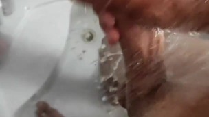 Jerking off a monster cock at the shower