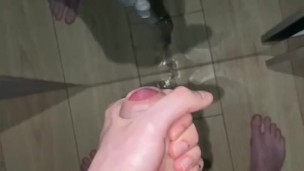 A young guy jerks off in front of the mirror and sweetly moans and cums