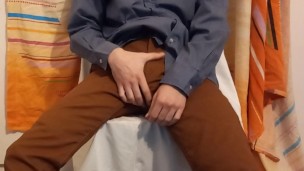 Man in suit grabbing his bulge