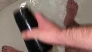 Young hairy daddy plays with flashlight in shower
