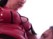 Femdom. Two dominatrixes in latex pegging their sissies in the mouth. 13/16