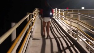 Man walks in a diaper across the public bridge