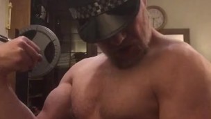 Naked horny muscular cop wearing his police hat turns himself on flexing his big bicep and cums