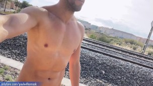 Muscle man gets naked next to train rails! Very hot body