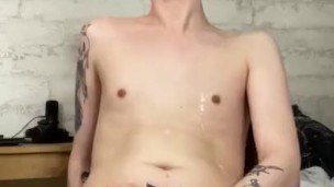 Twink masturbates his uncut cock and shoots his cum right into his mouth