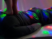 Dominatrix Nika tramples the body of a slave with bare feet 7/16