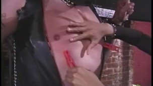 Getting him tied up to the wall, an Oriental floozy went on to pinch a dude’s nipples and spank him.