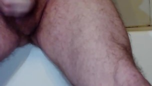 masturbating on the edge of the bathtub