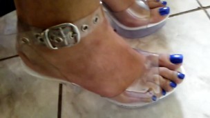 Blue long toenails in clear heels taking a piss