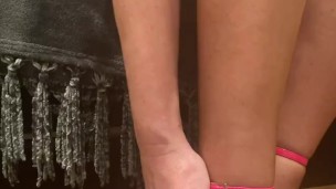 Stocking feet and pink heels