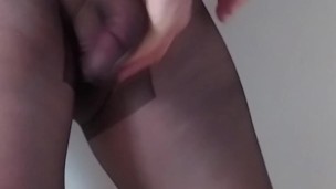 Man jerking off his cock in pantyhose with closed dick pouch cumming in nylons