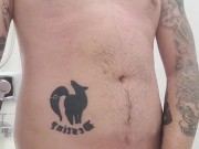 Tattooed guy cums a load in the shower